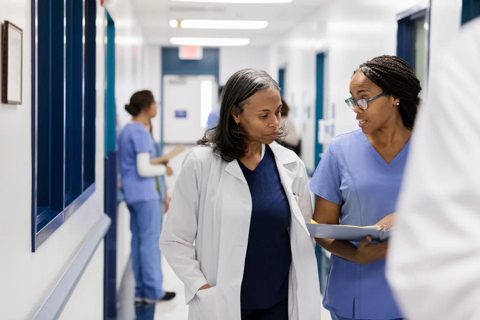 Healthcare colleagues reviewing information together in a hospital